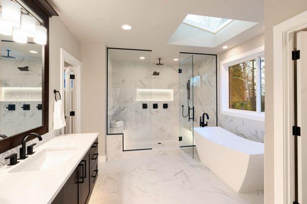 Clean design bathroom with shower and shower tub for Lenny.
 Sunset Home Builders INC.