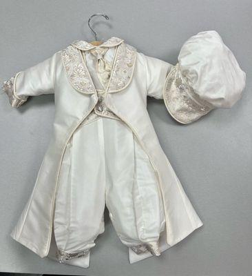 A showstopper christening silk suit 
With a gold brocaded vest and matching cap 
With a ankle length coat to complete
The royal look