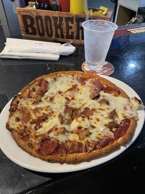 Cauliflower crust pizza with sausage & pepperoni.