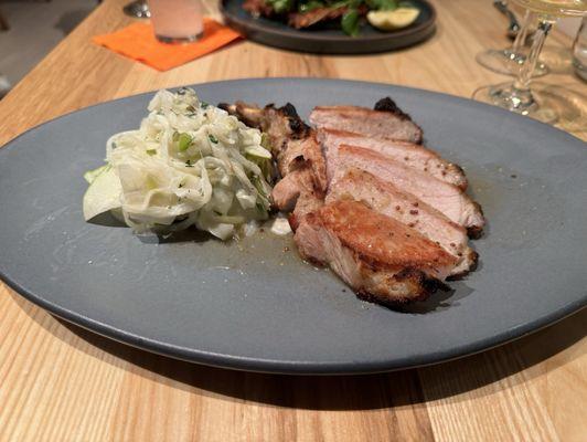 Wood fired pork chop with fennel green apple slaw