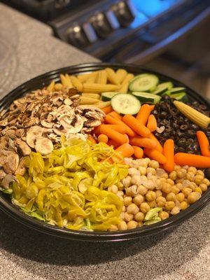 This is the family sized salad; olives, mushrooms, baby corn, cucumbers, lettuce, carrots, chick peas and on and on!