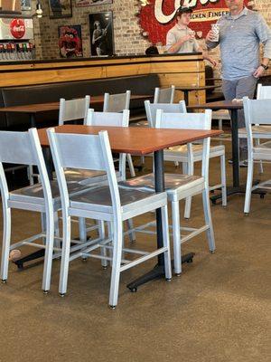 Food left on other tables across dining room.