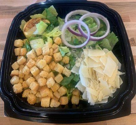 Fresh Romaine Lettuce, Shaved Parmesan Cheese, Grilled Lemon, Red Onion topped with Cheese and Garlic Croutons.  Served Caesar Dressing