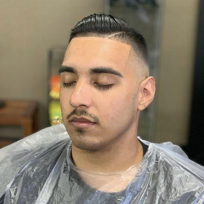 Mid bald fade comb over with a line up & hard part