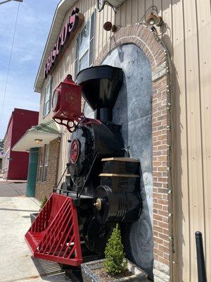 Exterior train theme adjacent to railroad tracks