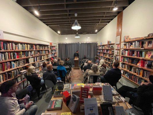 Pic of one of the many community nights where authors and guests are invited to speak / read sections of their fave work