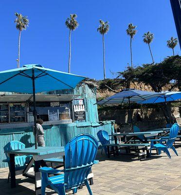 Cute outdoor setup and beautiful environment where you can relax and enjoy your food and/or beverage.