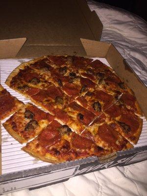 Pepperoni and sausage on thin crust.