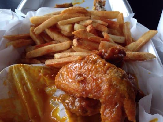 I had 3 wings but this is 2 w/ honey gold sauce & the best season  fries I've ever had. I  don't like but I'm  glad I tried them