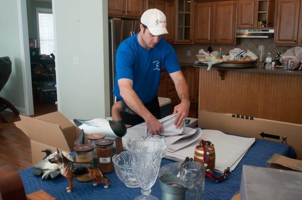 Packing up kitchen items.