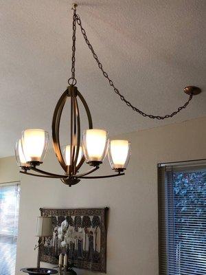 Stiffer satin brass chandelier.