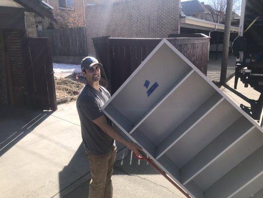 Moving a bookcase.