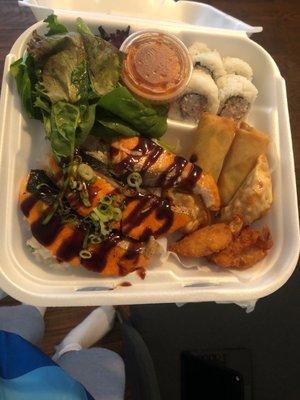 Combo Box 1, w. Salmon. side of salad, 4 sushi rolls, egg rolls.