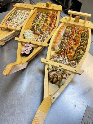 All you can eat sushi , signature rolls , appetizers on a boat