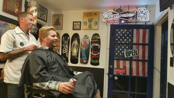 Another satisfied customer at the BLKHRT barbershop.