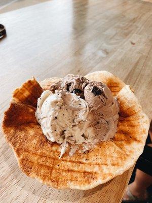 Cookie dough and brownie batter in a waffle cup.