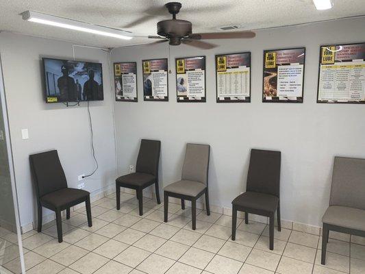 Waiting room with entertainment that customers can watch as well as informative posters you can read while your vehicle is being looked at.