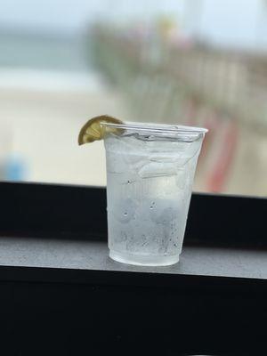 Water, rocks with lemon. They even took the drink and froze it for the ice.  Well made and presented.