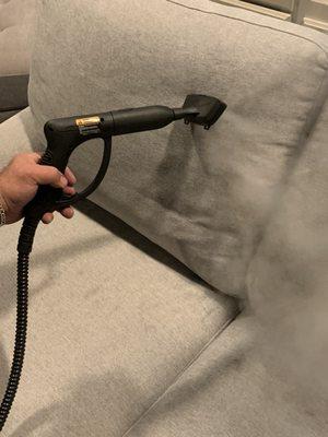 Steam-cleaning: over 120C* of high pressure heat. The high heat will kill and remove all the bacteria and will get rid of the smell's.