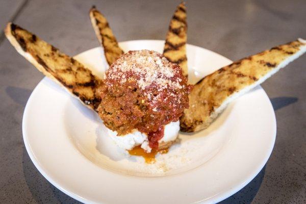 "THE 1/2LB. MEATBALL" Signature 1/2lb. meatball served with ricotta