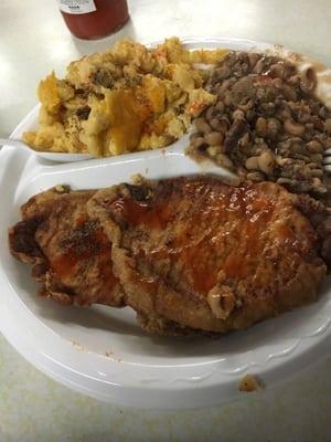 Fried pork chops, mac & cheese  with black eye peas.