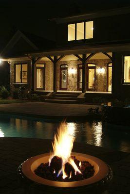 Fire Pit burning behind a Paradise Custom Home in San Antonio