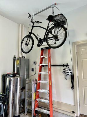 Client had very little floor space. They asked BOS to find a way to alleviate this situation. Their bikes were hung on a pulley system.