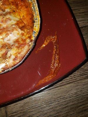 Plastic that was inside of the lasagna, this sure doesnt look good.  WTF!!!!  Why is there plastic inside this lasagna?