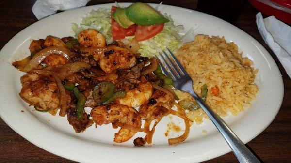 Texans fajitas, no beans. Chicken, beef, AND shrimp. Amazing!