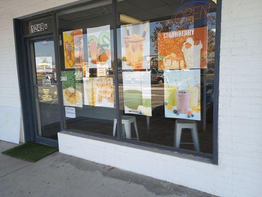 The store front, just the front.Nothing but the front, and some highlight reflective windows.