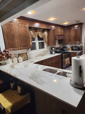 Countertop and backsplash by Granite Surfaces from a very satisfied customer