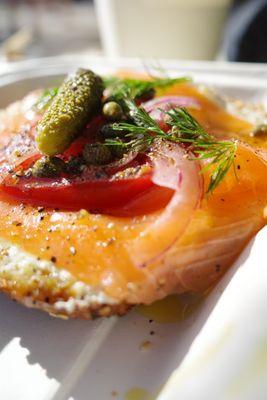 Hand cut smoked salmon over everything bagel