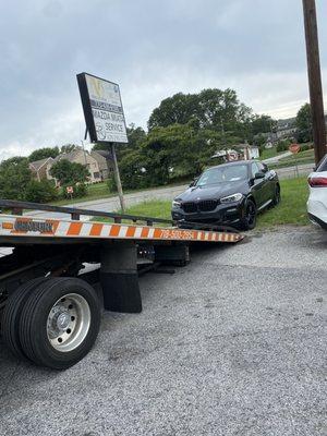 BMW dropped off to be repaired at mechanic shop