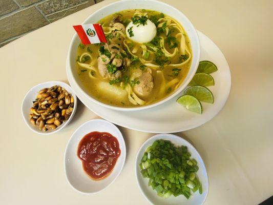 Caldo de Gallina is a soup made with Hen meat and served with noodles, boiled egg, and fresh herbs.