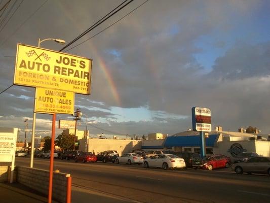 Front Sign with Rainbow in background