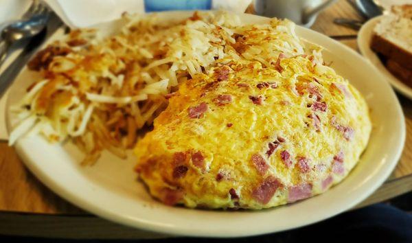 Egg beater cheese and ham omelet with hash Browns