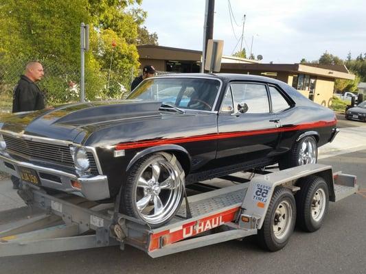 1968 Chevy nova on 20 inch American racing torq thrust rims & tires staggered.