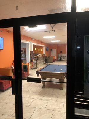 There is additional dining space with a pool table.