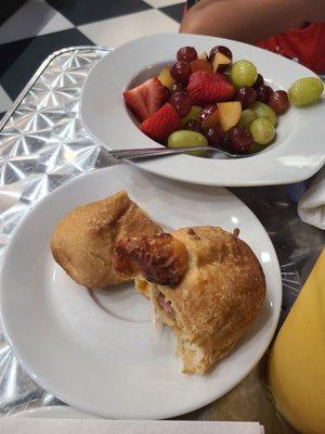 Sausage and cheese kolache with fruit bowl. My 4 year old loved it.