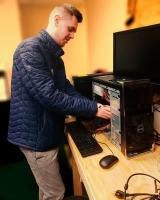 Everyone loves Caleb and he really loves getting into the guts of the computers.