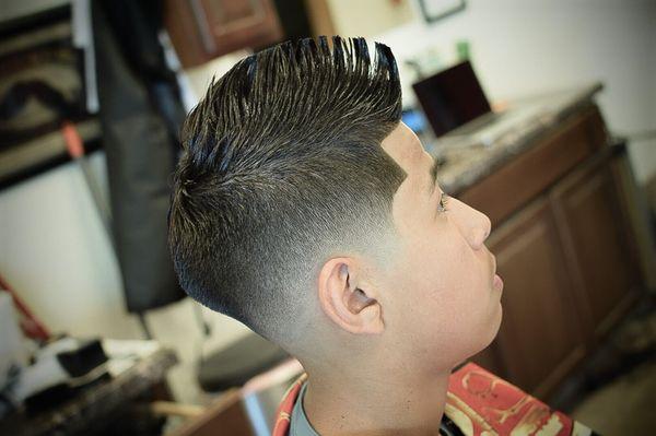 A Fohawk with a Drop Blurey Skin Fade.     Done by @n8sogreat