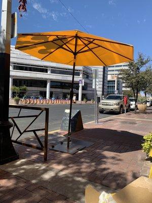 Outdoor seating and library across the street