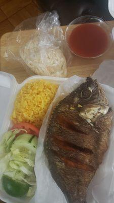 Mojarra Frita (Fried tilapia with rice and salad)