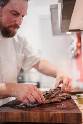 Chef Adam Cutting Baby Back Ribs