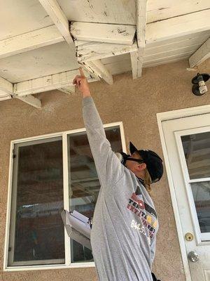 Jeff (inspector) checking for dry-rot or weather damage.