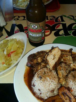 Jerk chicken  (white meat), rice and beans with cabbage.