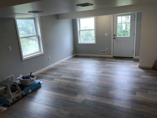 Same basement in Fairview, owner installed his own floating floor, we did everything else, new door, new trim, we did some ductwork above.