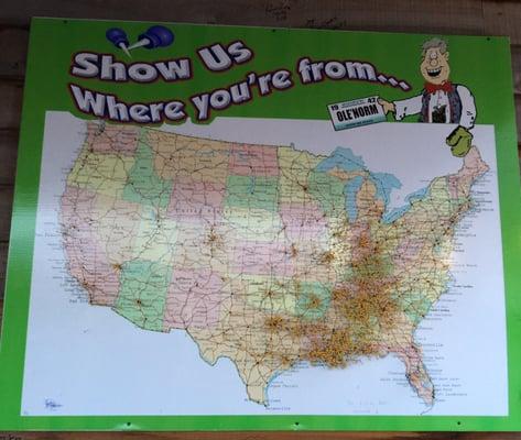 Sign outside the gift shop - leave your old car tag here to show where you're from.