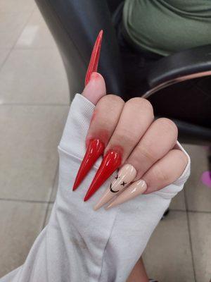 Long stileto nails. The red on my fingers are just from the monomer for the acrylic being dyed from the powder.