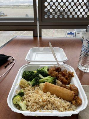 Rice, orange chicken, veggies, egg roll